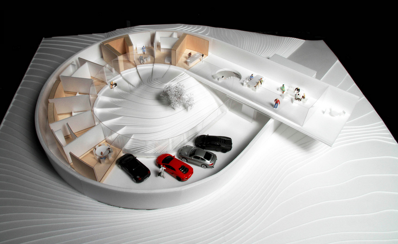 Illustration for article titled This Massive Concrete Loop Is Part House, Part Car Gallery